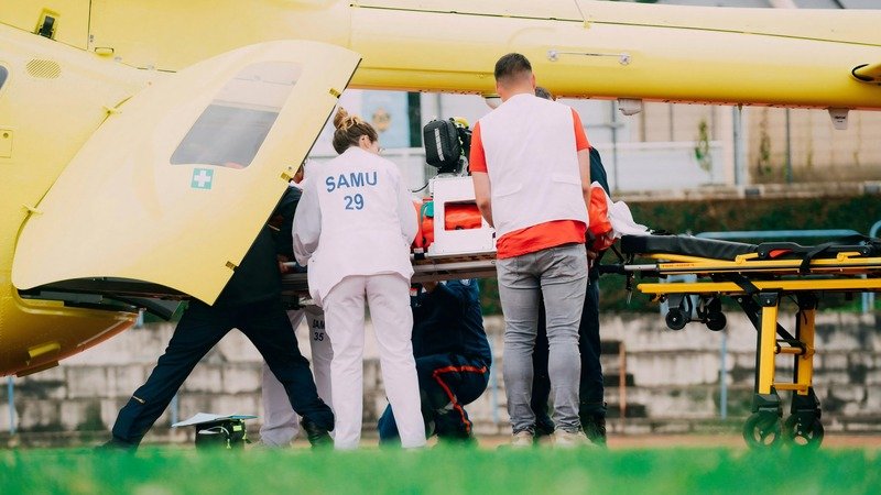 A medical team practicing with a stretcher
