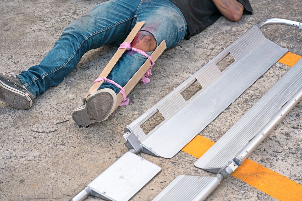 a scoop stretcher in use by paramedics