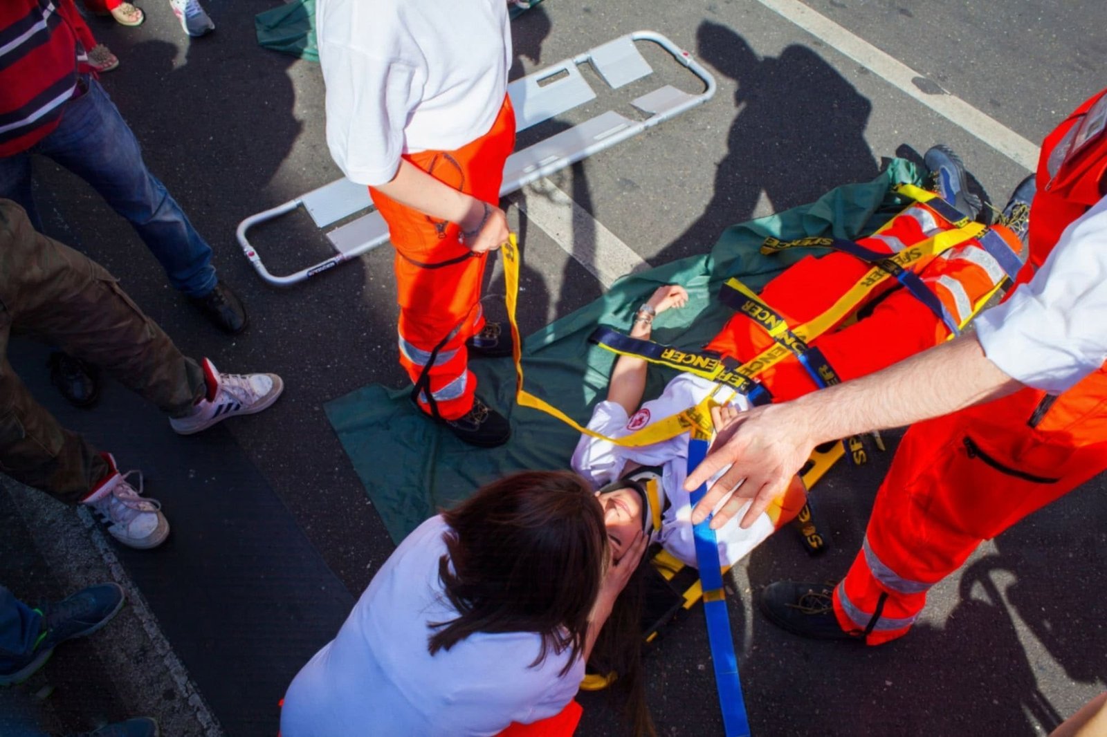 An array of patient transfer devices: spine board, scoop stretcher, and vacuum mattress