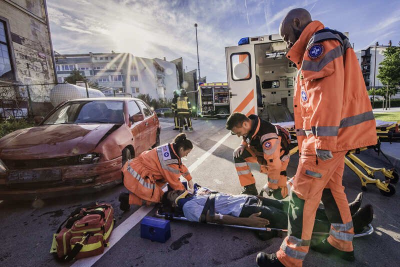 A scoop stretcher ready for use in an emergency setting