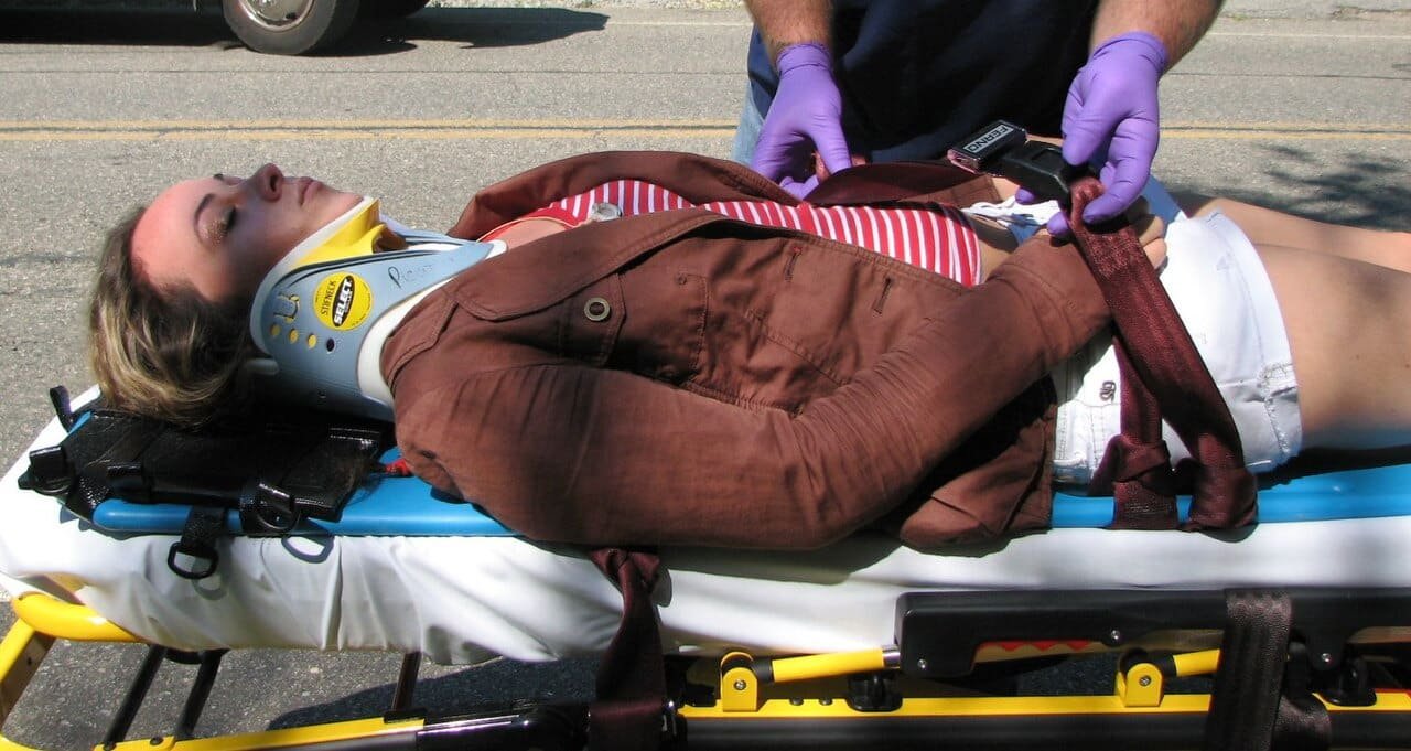 Emergency responder applying a cervical collar