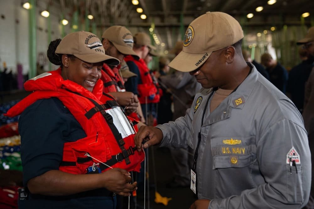 Crew members preparing life jackets for marine operations