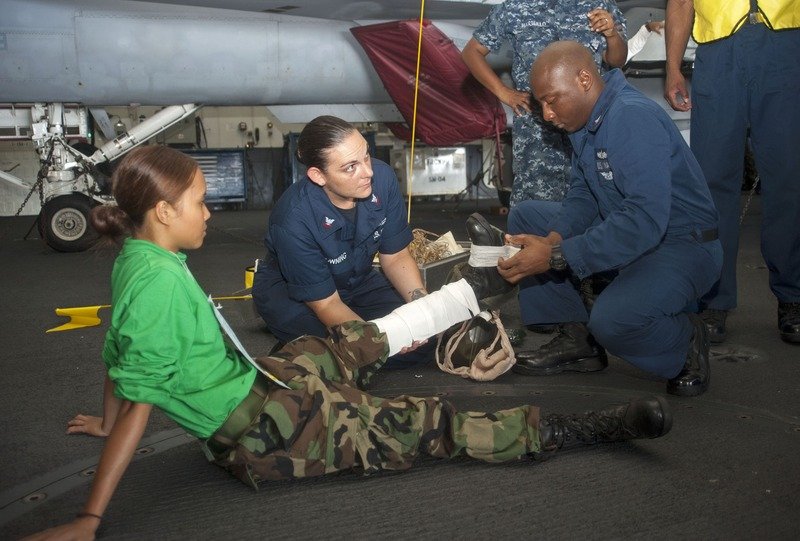 Emergency responders applying a medical splint to an injured leg