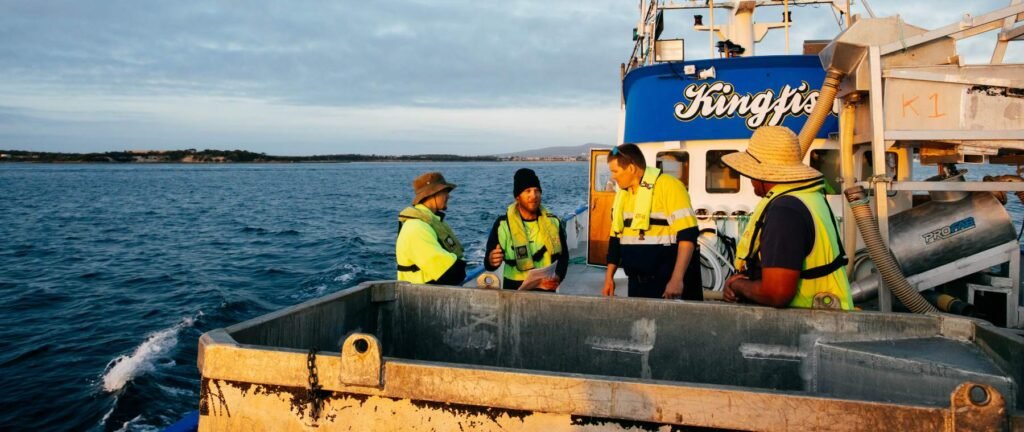 Offshore crew wearing life jackets during a vessel safety drill